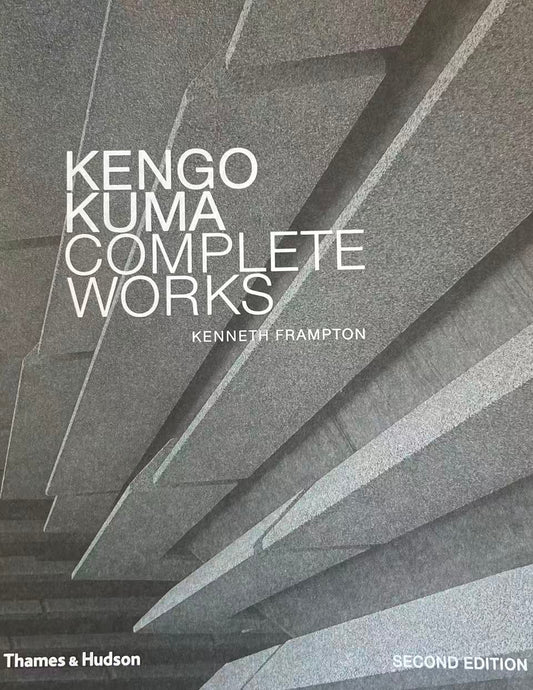 Book titled 'Kengo Kuma Complete Works' by Kenneth Frampton on a yellow surface.