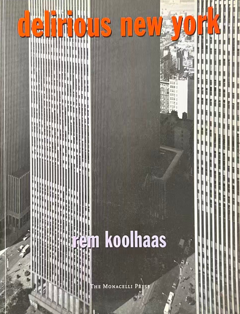 Book cover of 'delirious new york' by Rem Koolhaas with a black and white photo of a cityscape.